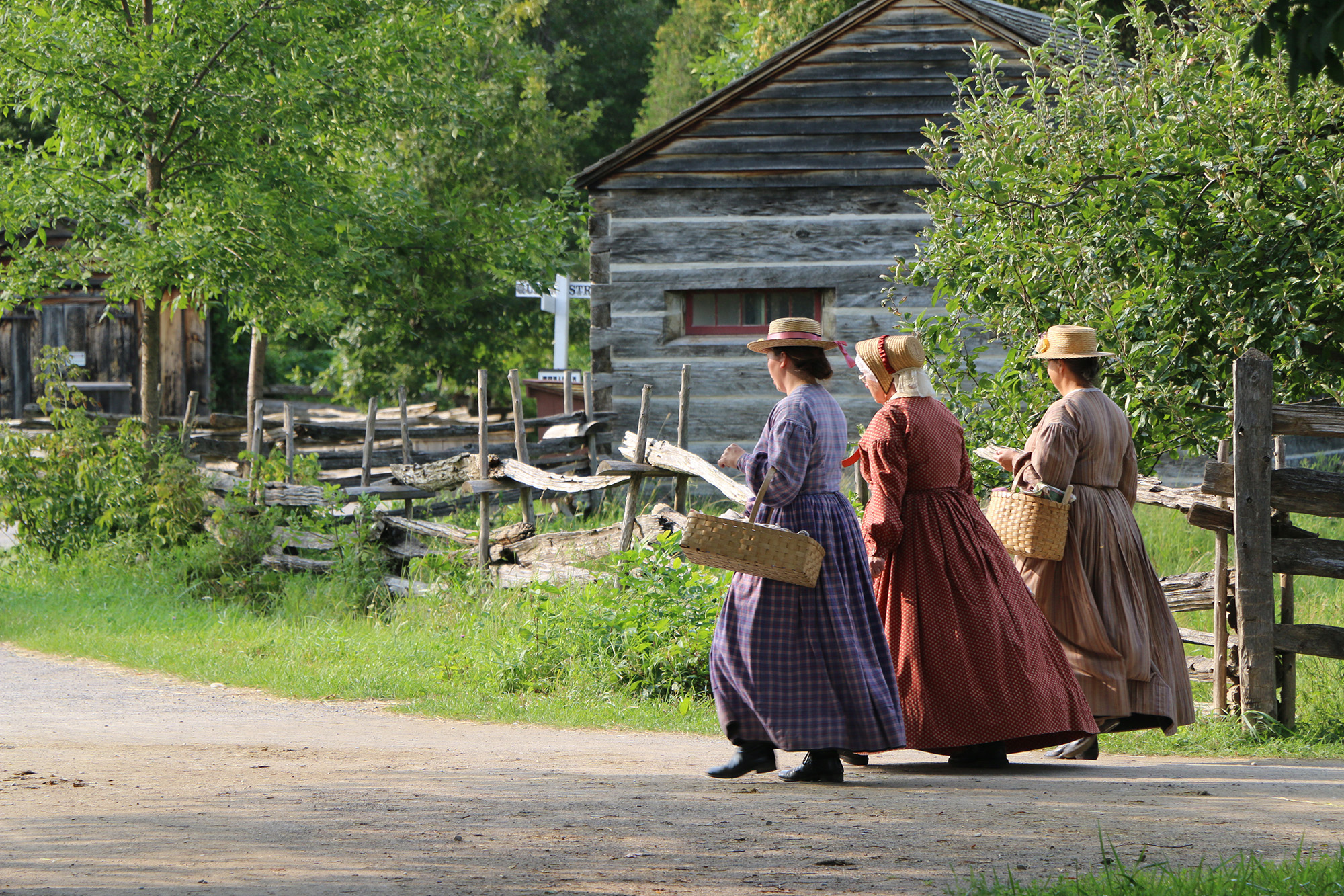 women walking in 1860s village