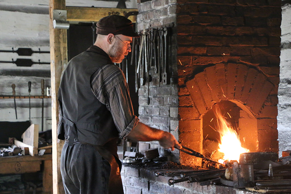 Blacksmith forging metal